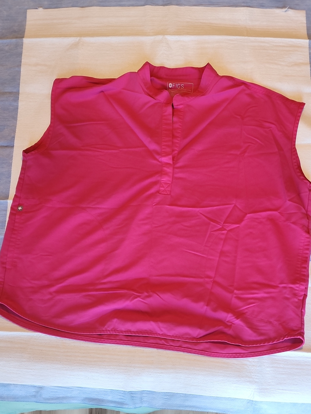FIGS Sleeveless Woman Nurse Scrub Top in Hot Pink